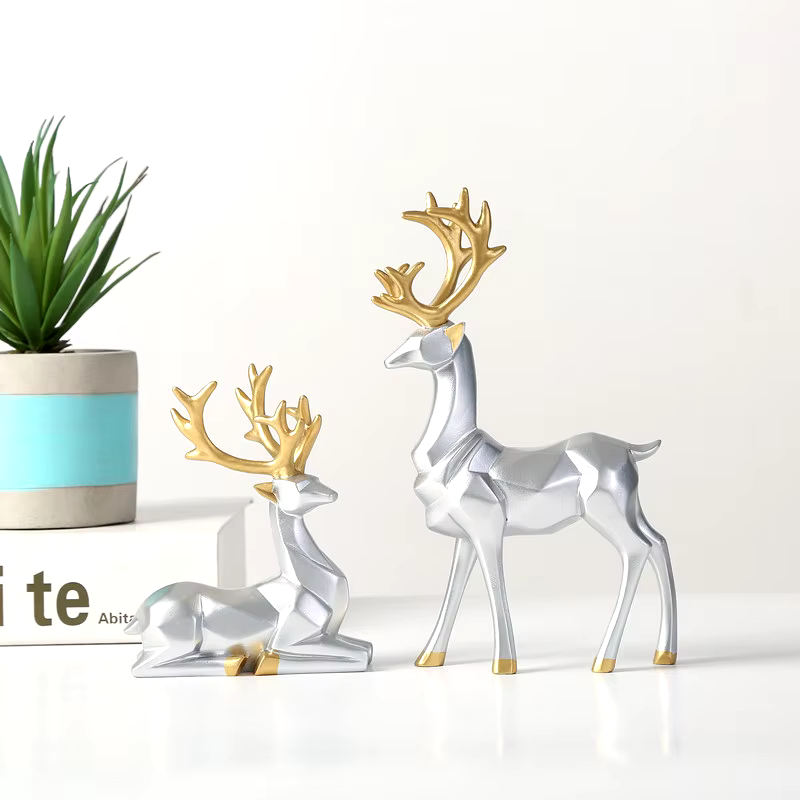 2Stück™ – Geometrische Goldene Elch-Skulptur aus Harz