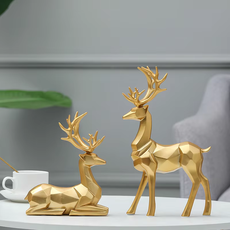 2Stück™ – Geometrische Goldene Elch-Skulptur aus Harz